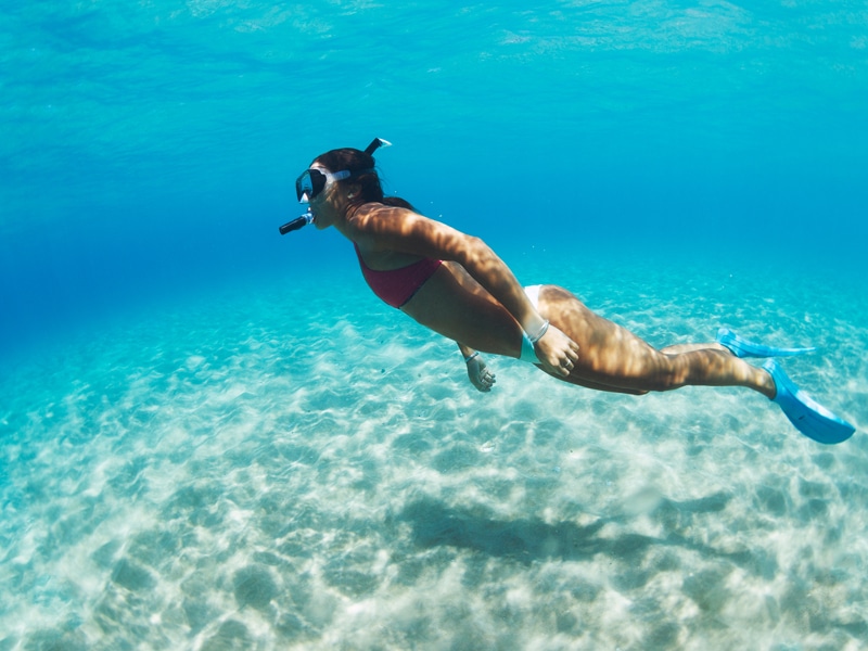 Woman snorkeling by herself