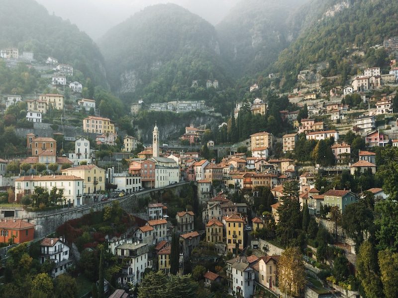 Aerial panoramic drone view of Moltrasio town on Lago di Como lake, Italy.