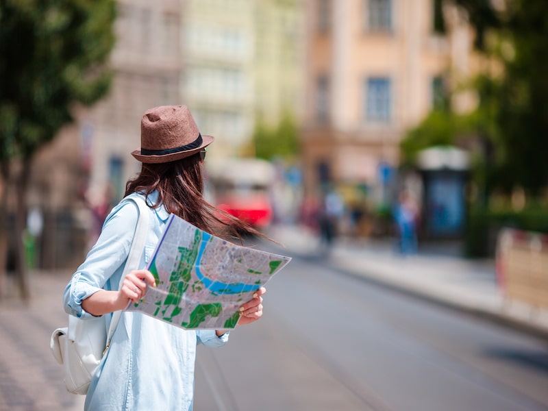 woman looking at map in European city