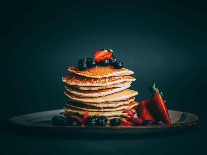 American pancakes with fresh blueberries and strawberries