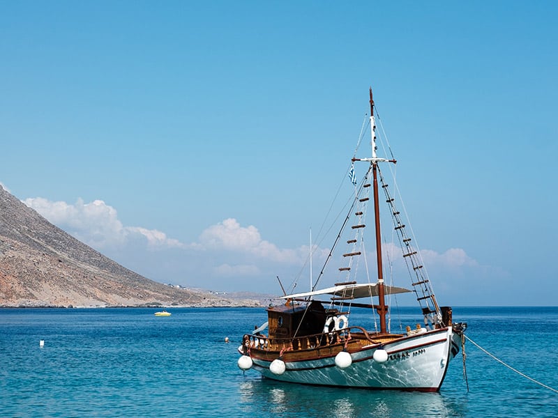 Boat tied up in bay in Greece